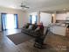 Comfortable living room with couch, rocking chair, and hardwood flooring that leads to dining at 2504 Hovis Rd, Lincolnton, NC 28092