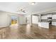 Bright open-concept living area features wood floors and a sliding glass door leading to the deck at 2504 Hovis Rd, Lincolnton, NC 28092
