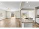 The open layout allows seamless transition from the living area to the kitchen, featuring hard wood floors at 2504 Hovis Rd, Lincolnton, NC 28092