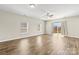 The light-filled living area is enhanced by wood floors and features large windows and access to the outdoor deck at 2504 Hovis Rd, Lincolnton, NC 28092