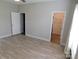 Bright main bedroom with neutral walls and flooring, walk in closet at 2504 Hovis Rd, Lincolnton, NC 28092