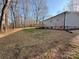 Large backyard with a deck and views of mature trees at 3094 Hollywood Dr, Gastonia, NC 28052