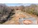 The aerial view shows a fenced-in area with various training stations, ideal for dog training at 312 Motz Ave, Lincolnton, NC 28092