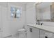 Stylish bathroom with a modern vanity, fixtures, and wainscoting details at 312 Motz Ave, Lincolnton, NC 28092