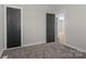 Carpeted bedroom with views into other rooms through open doors at 312 Motz Ave, Lincolnton, NC 28092