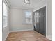 Cozy bedroom with modern vinyl floors, ample natural light, and a spacious closet for storage at 312 Motz Ave, Lincolnton, NC 28092
