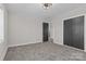 Spacious carpeted bedroom with closet and interior door at 312 Motz Ave, Lincolnton, NC 28092