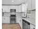 Bright kitchen features stainless steel appliances, granite countertops, and subway tile for a modern look at 312 Motz Ave, Lincolnton, NC 28092