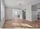 Inviting living room with new vinyl flooring and access to the kitchen and bedroom areas of the house at 312 Motz Ave, Lincolnton, NC 28092