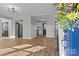 Open-concept living area with modern gray walls, vinyl floors, and recessed lighting offers style and comfort at 312 Motz Ave, Lincolnton, NC 28092