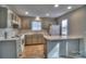 Cozy kitchen featuring neutral cabinets and a breakfast bar at 3258 Summercroft Ln, Charlotte, NC 28269