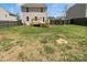 Fenced in backyard with grass and access to the back deck of the home at 352 Anvil Draw Pl, Rock Hill, SC 29730