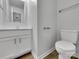 Well-lit bathroom with a toilet and vanity, offering a clean and functional design at 352 Anvil Draw Pl, Rock Hill, SC 29730