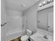 Bright bathroom with a tub, shower, toilet, sink and a large mirror at 352 Anvil Draw Pl, Rock Hill, SC 29730