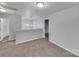Second floor landing area with neutral walls and carpet, and doorway into a bedroom at 352 Anvil Draw Pl, Rock Hill, SC 29730
