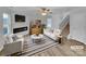 Bright living room with a fireplace, ceiling fan, and stylish decor for comfortable living at 352 Anvil Draw Pl, Rock Hill, SC 29730