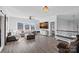 This living room features a fireplace, large windows for lots of natural light, and a comfortable sectional sofa at 3608 Mcpherson St, Waxhaw, NC 28173