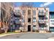 Attractive condo building featuring multiple balconies and street parking at 404 New Bern Station Ct, Charlotte, NC 28209