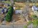 An aerial perspective shows a charming home with mature trees and lush greenery at 432 Lake Shore Dr, Fort Mill, SC 29715