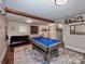 Finished basement featuring a pool table, game area, and laundry machines at 432 Lake Shore Dr, Fort Mill, SC 29715