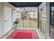Balcony with a storage closet, potted plant, and vibrant red rug overlooking the yard at 4811 Spring Lake Dr # C, Charlotte, NC 28212