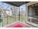 A balcony with wrought iron railings and a patterned red rug offers a view of the outdoors at 4811 Spring Lake Dr # C, Charlotte, NC 28212
