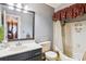 Functional bathroom with a vanity, toilet, and shower-tub combination, designed for everyday convenience at 4811 Spring Lake Dr # C, Charlotte, NC 28212