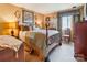 Comfortable bedroom with a decorative wooden bed frame, soft lighting, and tasteful furnishings, creating a relaxing space at 4811 Spring Lake Dr # C, Charlotte, NC 28212