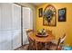 Charming breakfast nook featuring a round table, wooden chairs, and a unique decorative touch on the wall at 4811 Spring Lake Dr # C, Charlotte, NC 28212