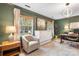 Bright home office featuring a murphy bed, two windows, modern lighting and hardwood floors at 5217 Addison Ave, Charlotte, NC 28211