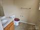 Modest bathroom with a vanity, toilet, and essential fixtures at 5315 Airport Dr, Charlotte, NC 28208