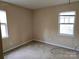 Another bedroom with two windows, ready for renovation and personalization at 5315 Airport Dr, Charlotte, NC 28208