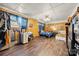 Spacious bedroom with wood-look floors, wood paneling, and bright, natural light at 5923 Charleston Ave, Kannapolis, NC 28081