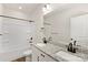 Bathroom featuring a double vanity with granite countertops and dark hardware at 6117 Grove Park Blvd, Charlotte, NC 28215