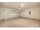 Spacious garage with an automatic door and concrete flooring at 6117 Grove Park Blvd, Charlotte, NC 28215