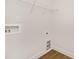 Empty laundry room with hookups for washer and dryer and a wire shelf at 6117 Grove Park Blvd, Charlotte, NC 28215