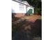 A modest home with white siding and a charming green-painted porch and steps at 630 Pinelake Dr, Troy, NC 27371