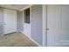 An enclosed back porch with an indoor/outdoor feel and easy access to the house at 704 Mill St, Albemarle, NC 28001