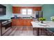 Modern kitchen with granite countertops, stainless appliances, and breakfast nook at 704 Mill St, Albemarle, NC 28001