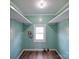 Bright laundry room featuring lots of natural light and built in shelving at 704 Mill St, Albemarle, NC 28001