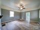 Spacious living room with fresh paint, new flooring, and natural light at 704 Mill St, Albemarle, NC 28001