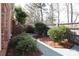 Backyard with paver patio, landscaped garden, and privacy fence at 815 Treverton Dr, Matthews, NC 28105