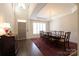 Bright dining room with hardwood floors, a chandelier, and ample natural light at 815 Treverton Dr, Matthews, NC 28105