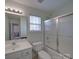 Practical bathroom with essential fixtures: sink, toilet, and shower over tub at 8353 Emily Dr, Harrisburg, NC 28075