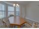A cozy dining area with great natural light offering a calm and inviting space for meals with Gathering and friends at 8353 Emily Dr, Harrisburg, NC 28075