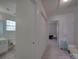 Hallway view with access to the bathroom on the left, a closet in the middle, and the bedroom on the right at 8353 Emily Dr, Harrisburg, NC 28075