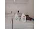 Well-equipped laundry area offers convenience with a washer, dryer, and practical shelving solutions for storage at 8353 Emily Dr, Harrisburg, NC 28075