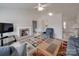 Comfortable living room featuring a brick fireplace, neutral walls, and plush seating arrangement at 8353 Emily Dr, Harrisburg, NC 28075