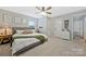 Relaxing bedroom featuring neutral colors, plush carpeting, and ample closet space for storage at 8701 Gainsford Ct, Charlotte, NC 28210