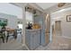 Spacious kitchen with stainless steel fridge, granite countertops and casual dining area with seating at 8701 Gainsford Ct, Charlotte, NC 28210